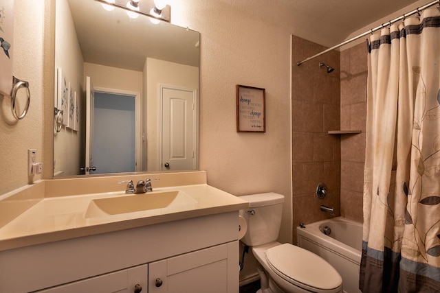 full bathroom featuring vanity, shower / bath combination with curtain, and toilet