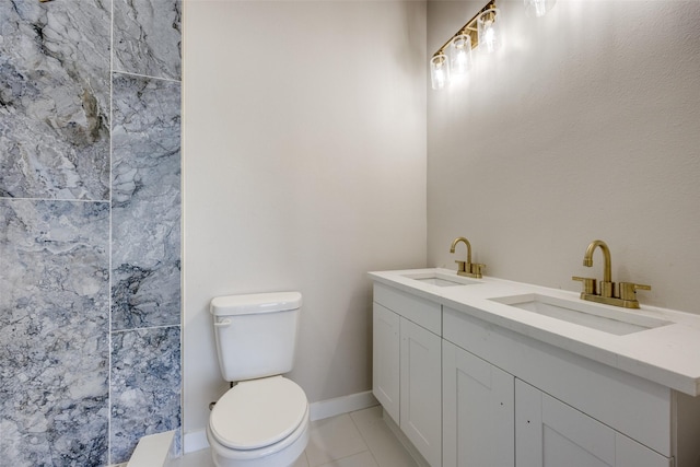 bathroom with vanity, tile patterned floors, and toilet