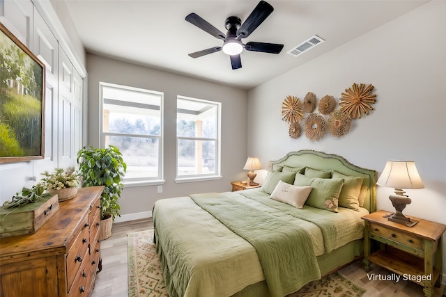 bedroom featuring ceiling fan and light wood-type flooring