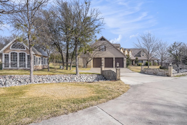 view of side of home featuring a yard and a garage