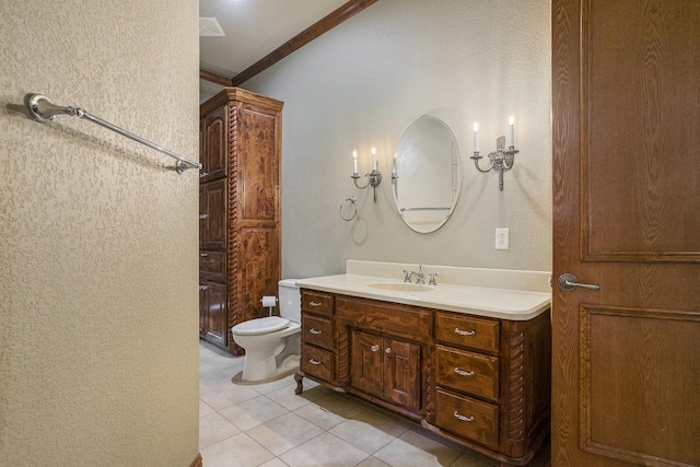 bathroom with vanity, tile patterned floors, ornamental molding, and toilet