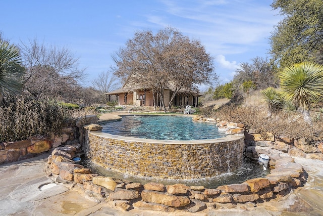 view of pool featuring pool water feature