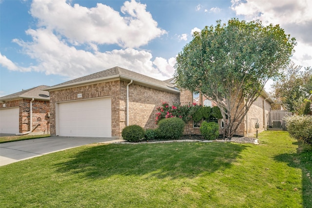 view of side of home featuring a garage and a lawn