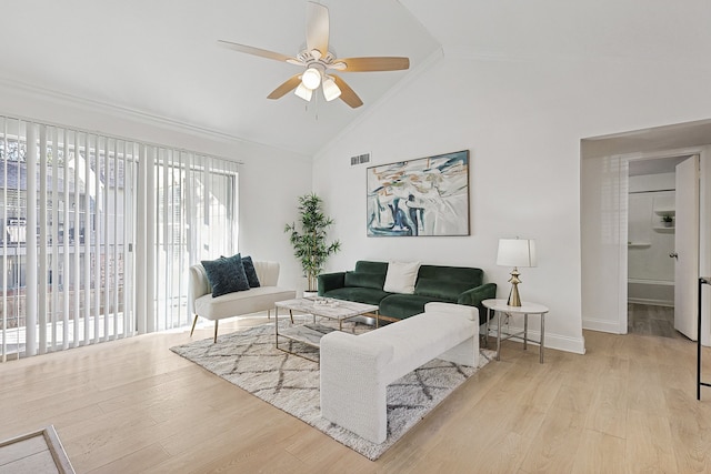 living room with crown molding, lofted ceiling, ceiling fan, and light hardwood / wood-style flooring