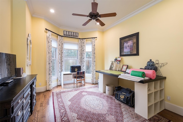 office space with crown molding, wood-type flooring, and ceiling fan