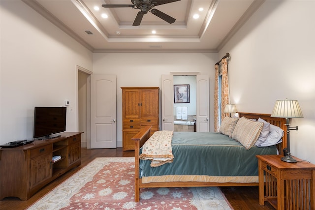 bedroom with ceiling fan, ornamental molding, a tray ceiling, and hardwood / wood-style floors