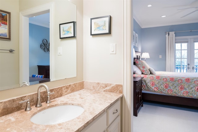 bathroom featuring french doors, ceiling fan, ornamental molding, and vanity