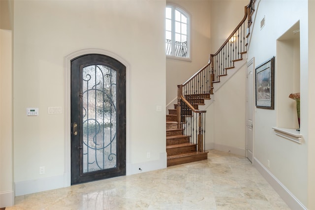 foyer featuring a high ceiling