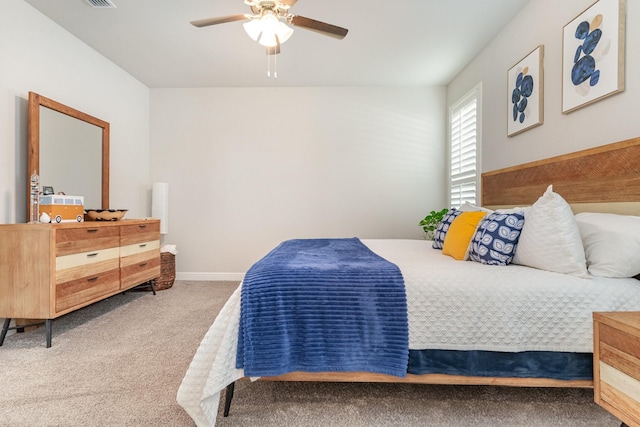 bedroom featuring ceiling fan and carpet