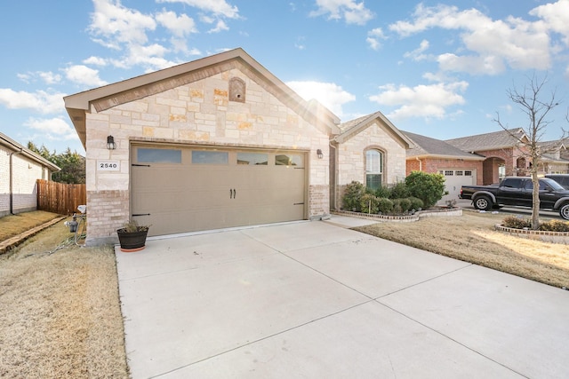 ranch-style home featuring a garage