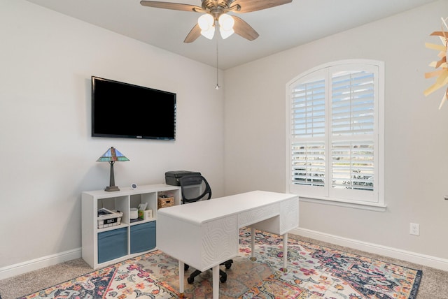 office space with ceiling fan, a healthy amount of sunlight, and carpet floors