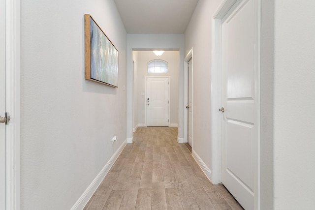 hallway with light wood-type flooring