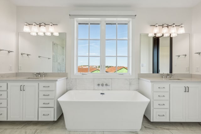 bathroom featuring vanity, tile walls, and a washtub