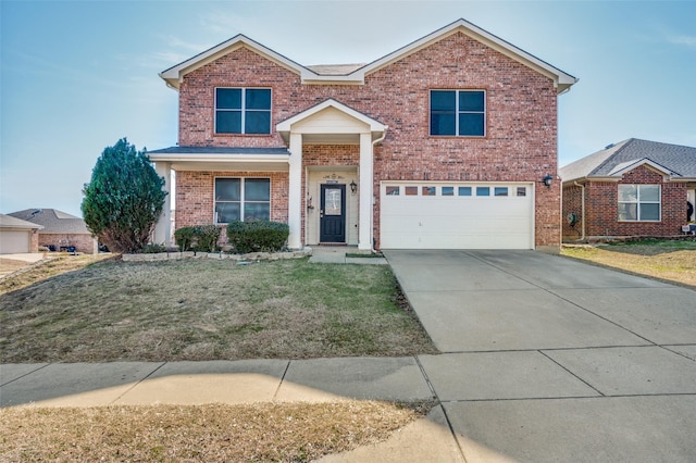 view of property featuring a garage and a front yard