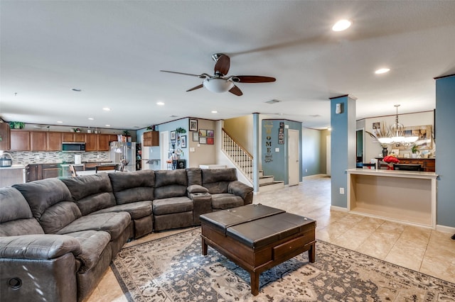 tiled living room featuring ceiling fan