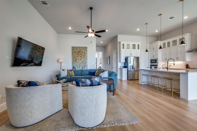 1154 20th St, Northlake, TX 76226 - living area featuring a ceiling fan, visible vents, light wood-style flooring, and recessed lighting