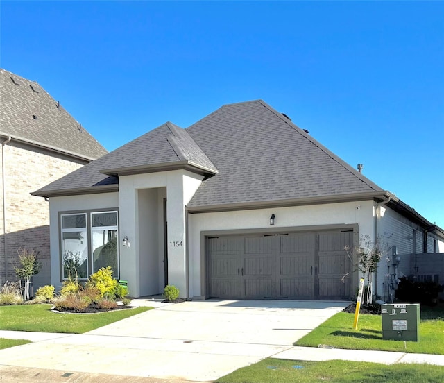 1154 20th St, Northlake, TX 76226 - view of front facade with a garage, roof with shingles, stucco siding, and driveway