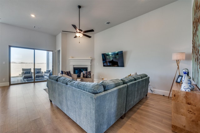 1154 20th St, Northlake, TX 76226 - living room featuring light wood-style floors, baseboards, ceiling fan, and visible vents