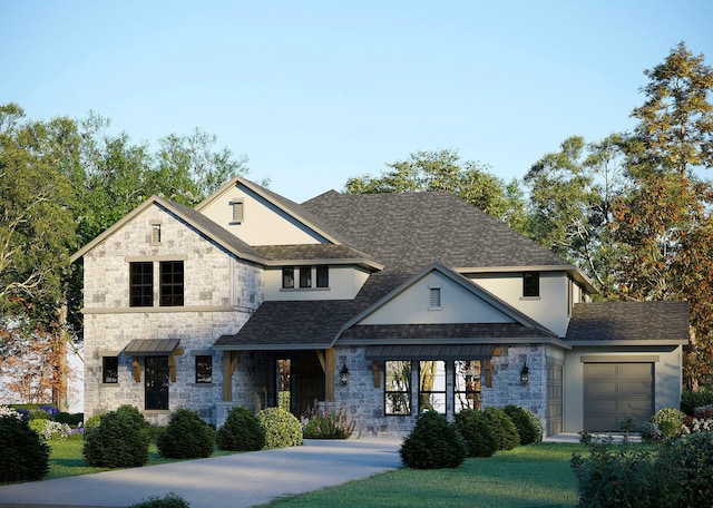 view of front of property with a garage and a front lawn