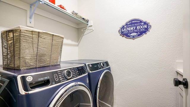 clothes washing area featuring washing machine and dryer