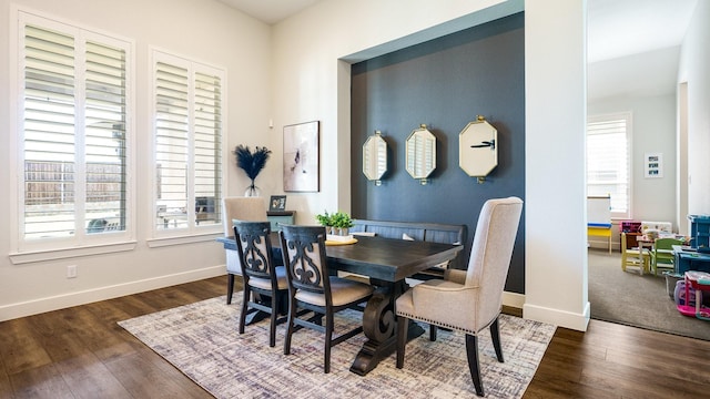 dining space featuring dark hardwood / wood-style floors