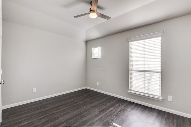 unfurnished room with ceiling fan and dark hardwood / wood-style flooring