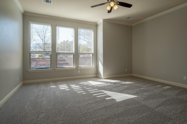 carpeted spare room with plenty of natural light, ornamental molding, and ceiling fan