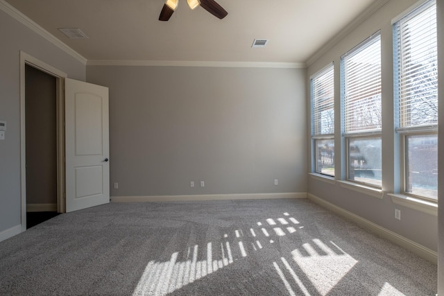 carpeted empty room featuring crown molding and ceiling fan