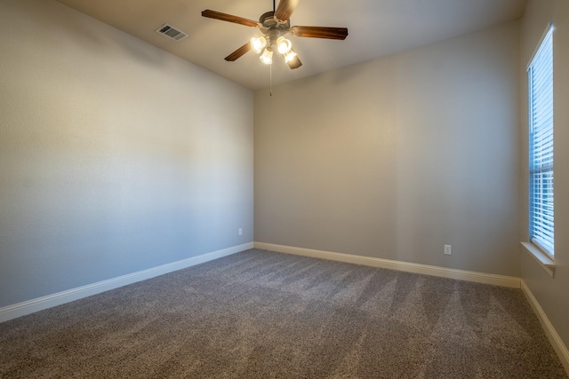 carpeted empty room with ceiling fan