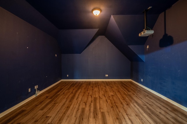 bonus room featuring lofted ceiling and hardwood / wood-style floors