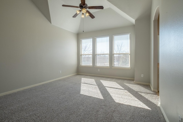 unfurnished room with ceiling fan, lofted ceiling, and carpet flooring