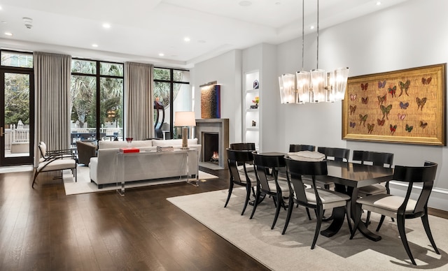 dining room with a chandelier and dark hardwood / wood-style flooring