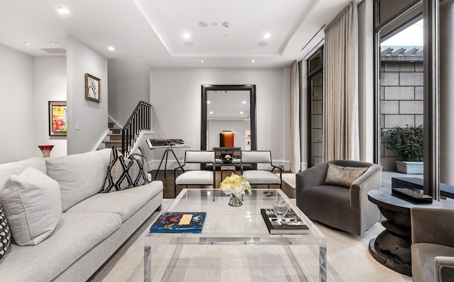 living room featuring a tray ceiling