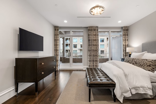 bedroom with dark wood-type flooring