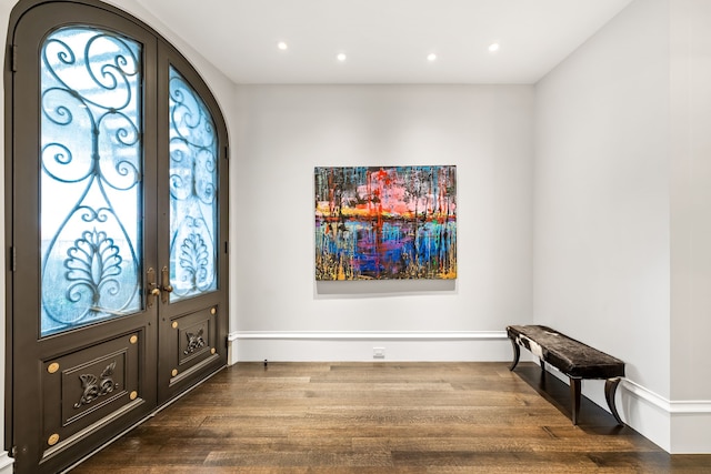 entrance foyer with french doors and hardwood / wood-style floors