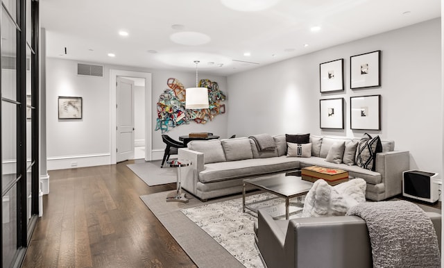 living room with dark hardwood / wood-style floors