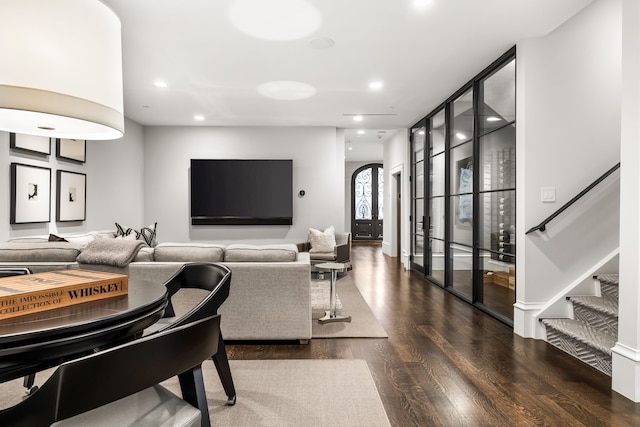 living room featuring dark wood-type flooring