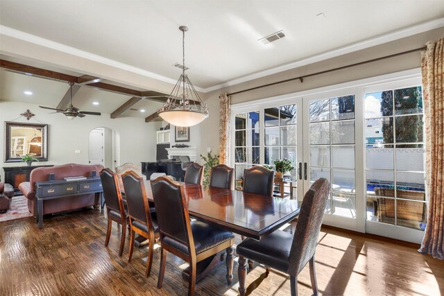 kitchen featuring appliances with stainless steel finishes, pendant lighting, white cabinetry, an island with sink, and sink