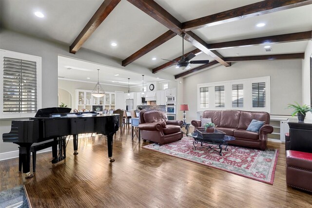 living room with sink, ceiling fan, vaulted ceiling with beams, a high end fireplace, and dark hardwood / wood-style flooring