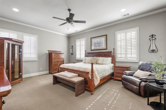 carpeted bedroom featuring crown molding and ceiling fan