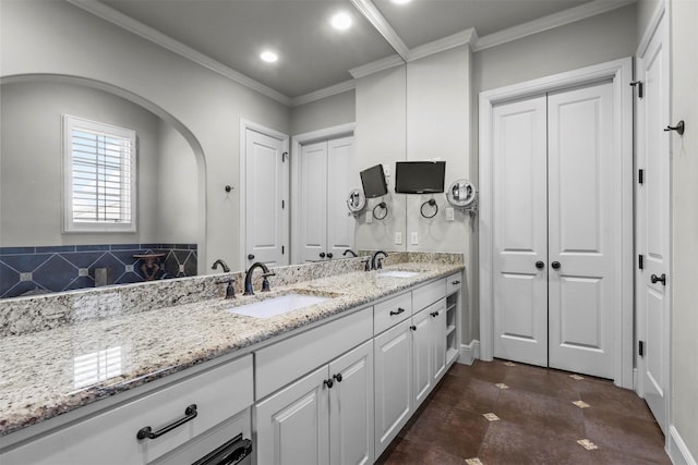 bathroom featuring vanity and ornamental molding