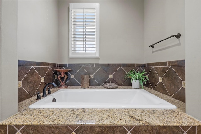 bathroom featuring tiled bath