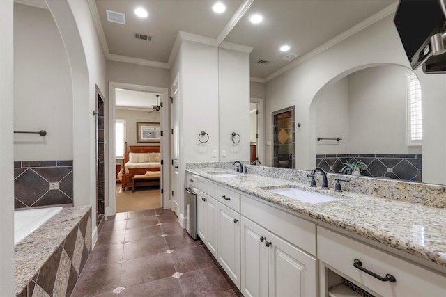 bathroom with ceiling fan, ornamental molding, independent shower and bath, and vanity