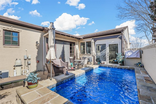 view of swimming pool featuring a patio