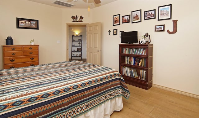 bedroom featuring ceiling fan and light hardwood / wood-style floors