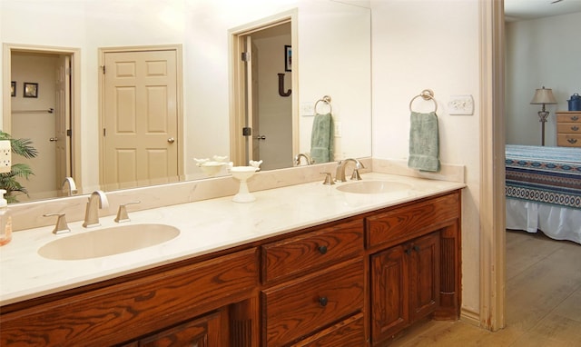 bathroom featuring hardwood / wood-style flooring and vanity