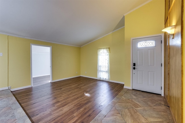 foyer entrance with lofted ceiling, crown molding, and wood-type flooring