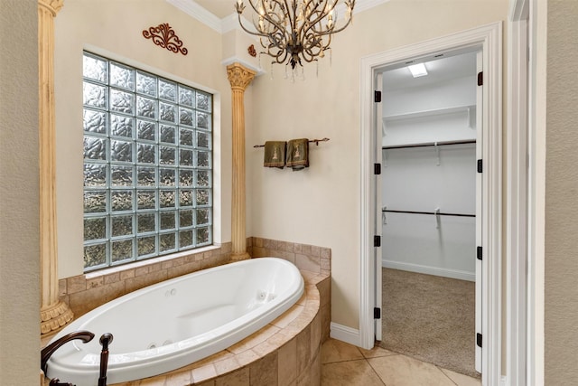 bathroom featuring a relaxing tiled tub, ornamental molding, tile patterned flooring, and a wealth of natural light