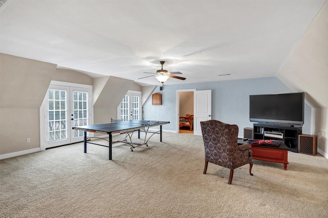 rec room with lofted ceiling, light colored carpet, french doors, and ceiling fan