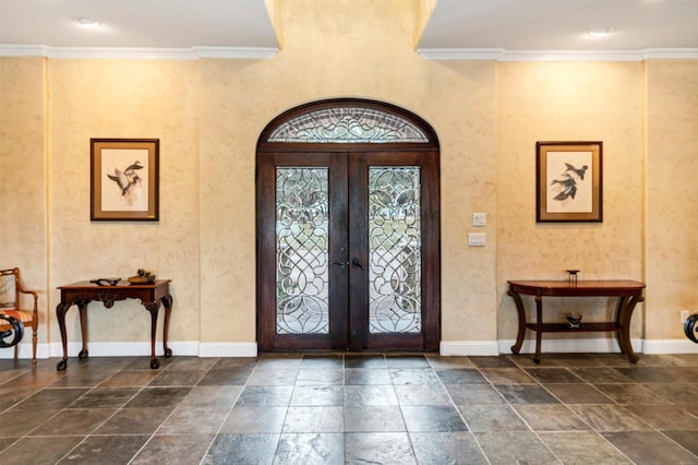 entryway featuring french doors and ornamental molding